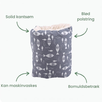 Armpudens egenskaber: kantsøm, blød polstring, kan vaskes, bomuld
